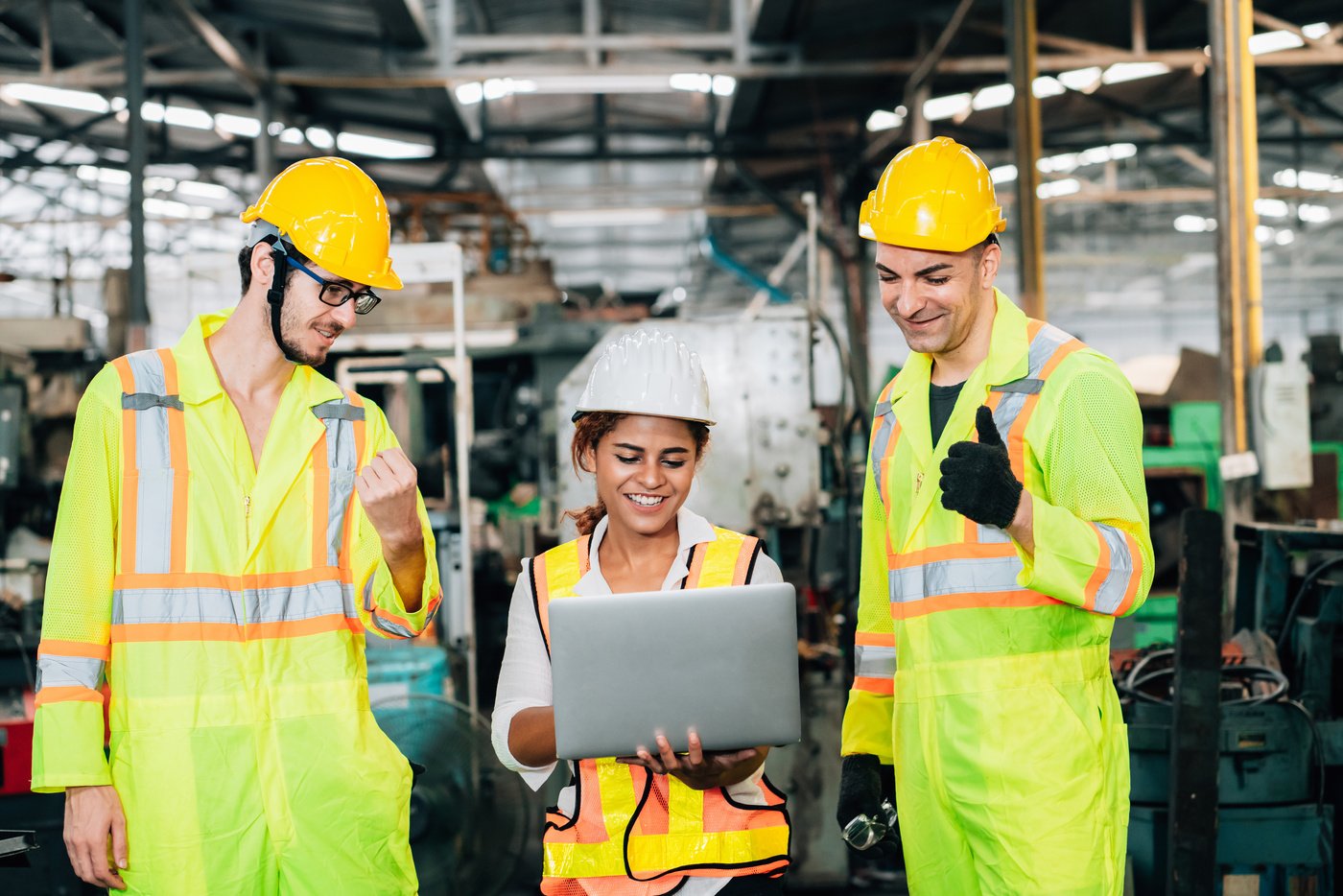 Teamwork with Happy Workers in Factory